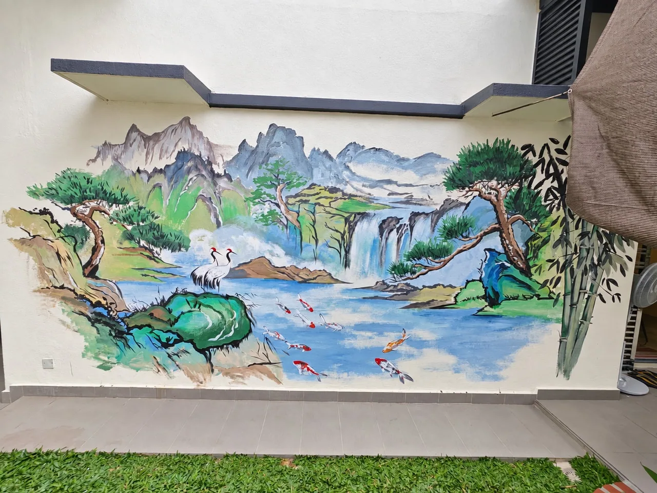 Landscape mural with mountains, waterfalls, pine trees, cranes and koi